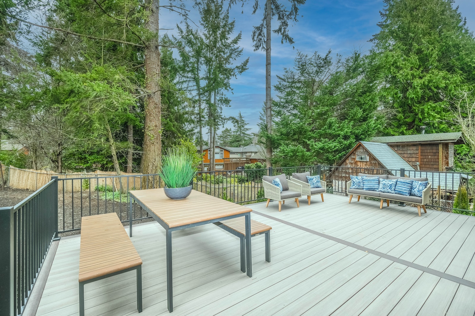 brown wooden table and chairs on wooden deck